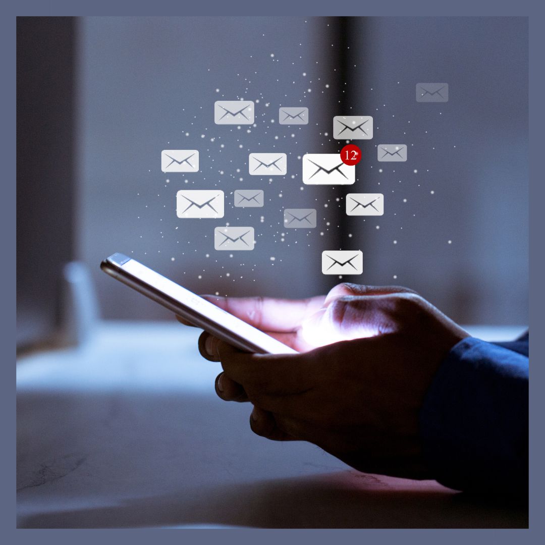 image of a person using their cell phone and several email graphics floating above to show Best Sales Prospecting Emails