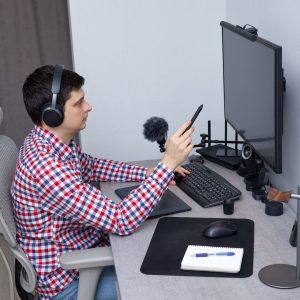 image of a man working remotely at his desk to show Remote Sales: Managing Productivity with Discretionary Work