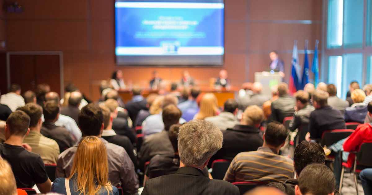 image of a sales conference to show Why Your Sales Kickoff Speaker Needs More Than a Script to Drive Real Growth